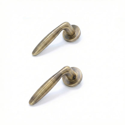Superior Sirius Lever on Round Rose Bathroom Handle Set - Antique Brass