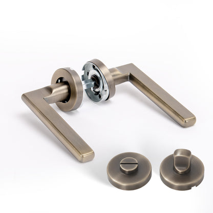 Superior Luna Lever on Round Rose Bathroom Handle Set - Antique Brass